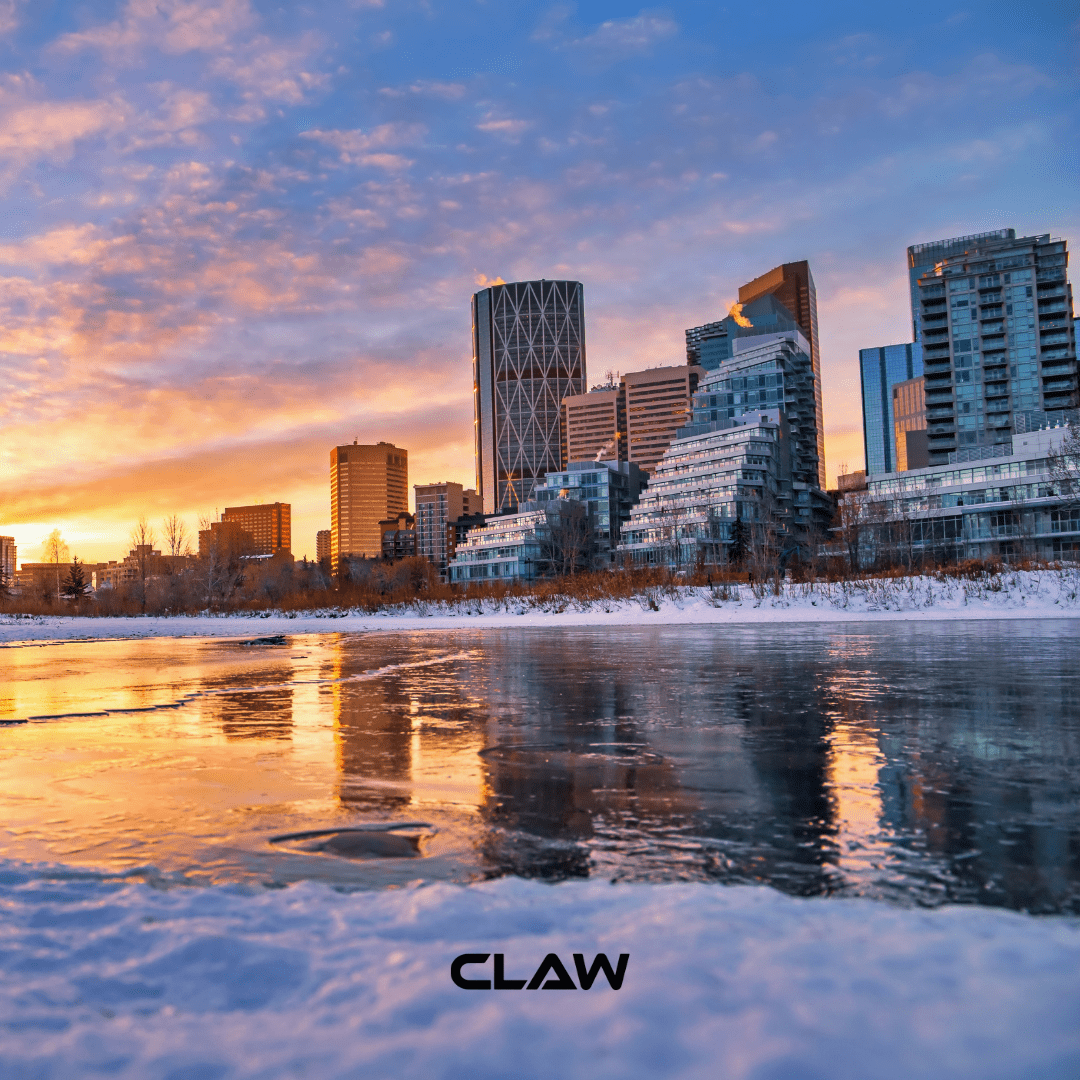 Calgary skyline at sunset where Claw Roofing is located