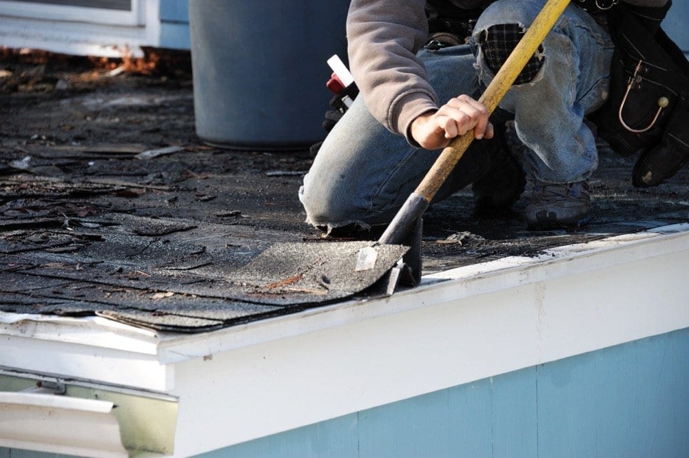 Calgary Roofing Companies | Claw Roofing | roofer doing a roof repair