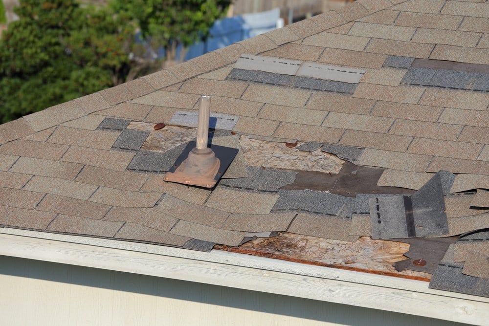 Calgary Roofing Company - Claw Roofing - A close up view of shingles and roof damage