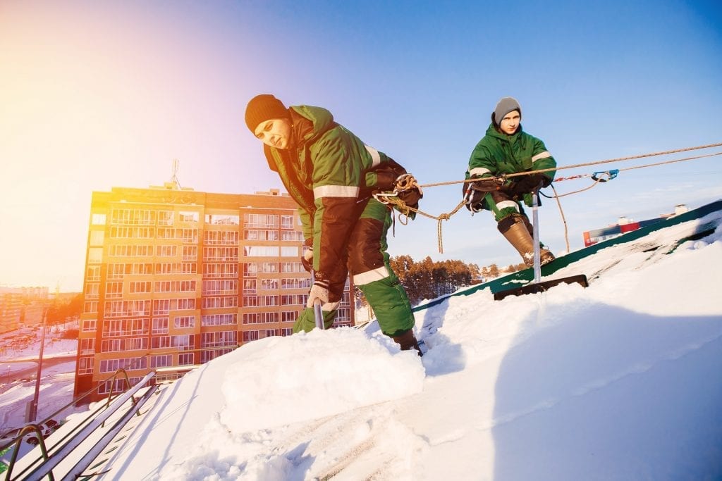 winter-roof-emergency-heavy-snow-removal-team-shoveling-roof